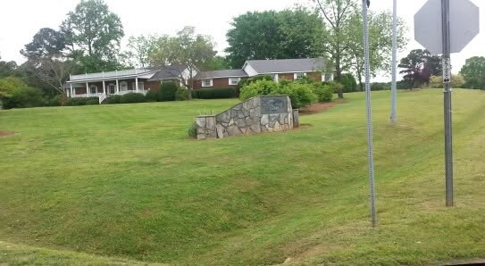Manicured lawn with stone feature